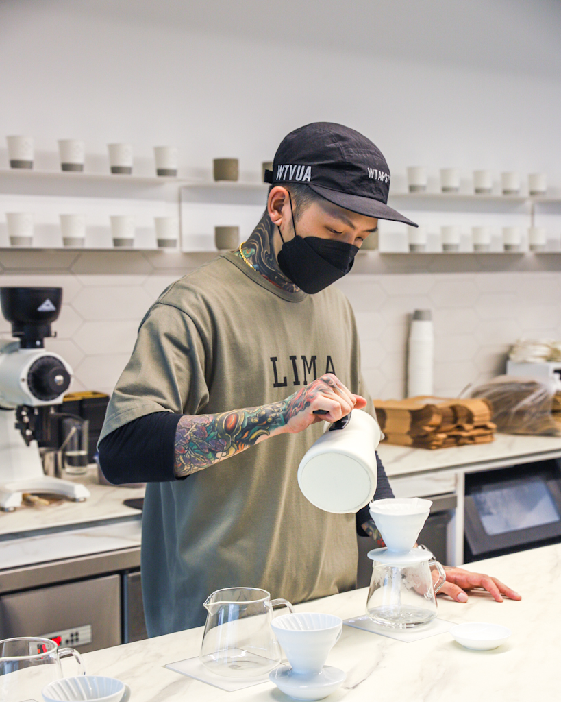 barista brewing filter coffee