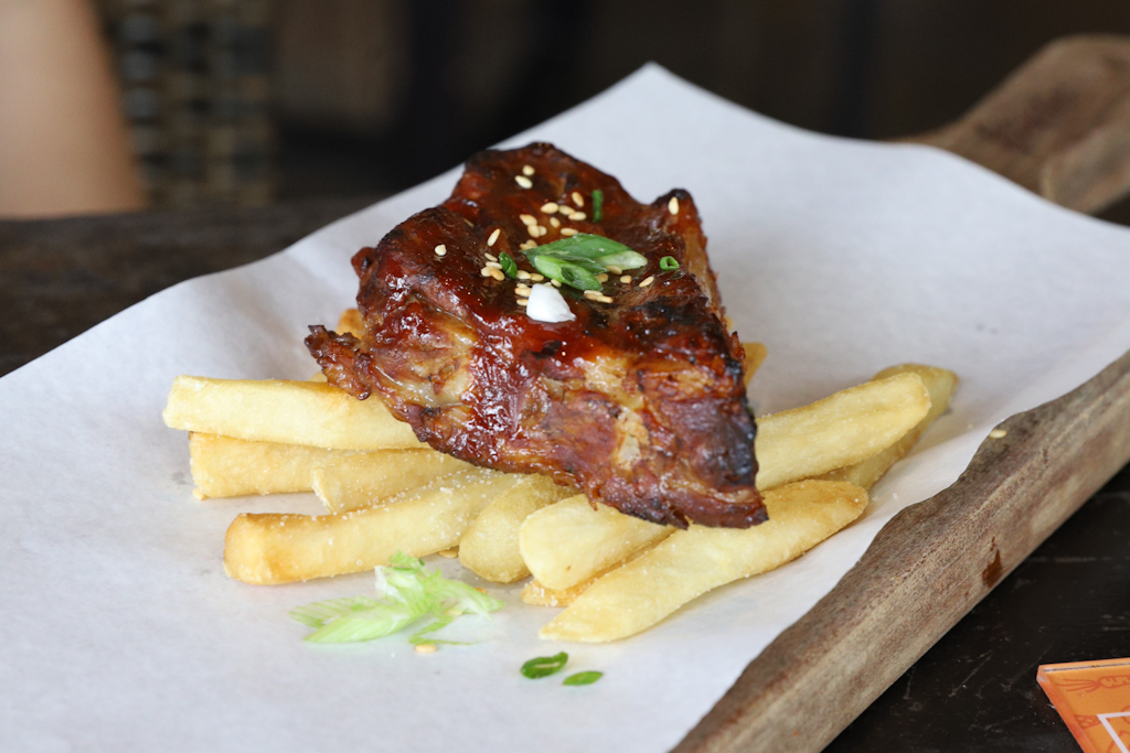 BBQ Baby Pork Ribs at Georges Singapore. Served on wooden platter