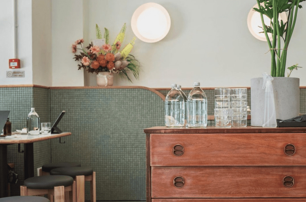 Neptune, Cafe at East Coast Road, teal, white and wooden interior design. Photo taken by @doggaebi