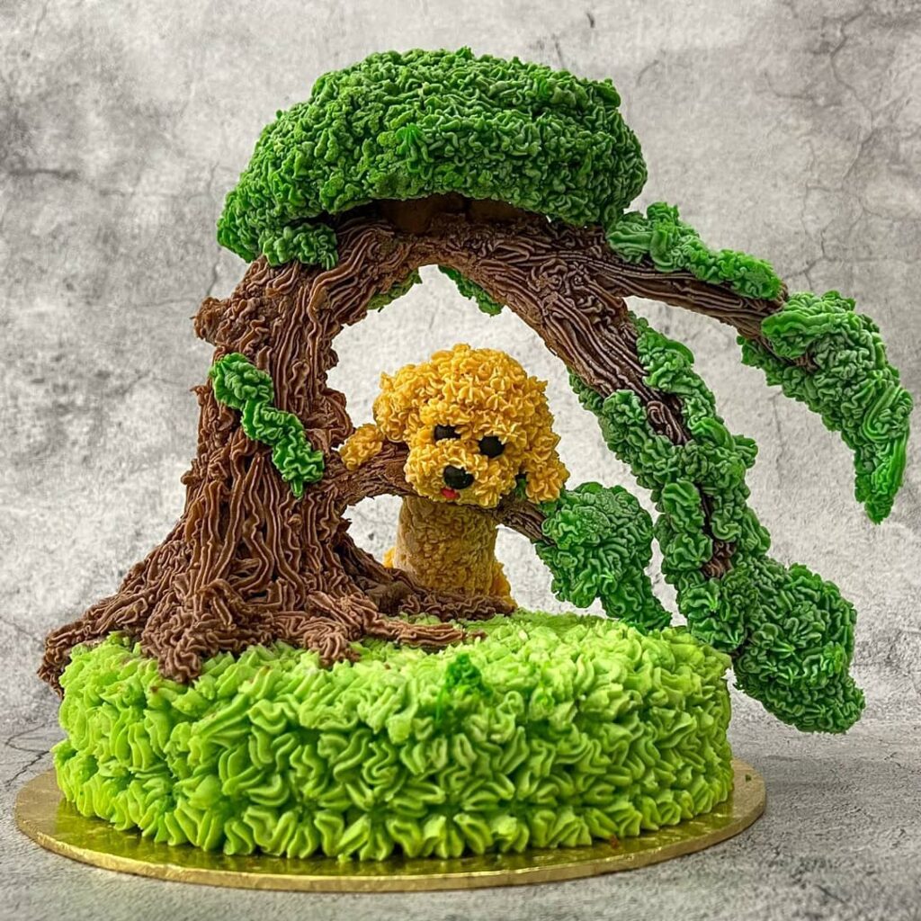 Bossipaw cake designs - dog hanging on tree. Source: Bossipaws