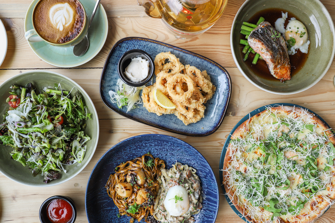 Flat lay of Korean fusion dishes at Bones n Slaw