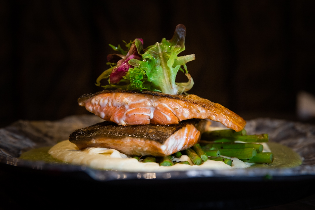 Wild caught Alaskan Salmon with mashed potato and pesto sauce at Tribeca Bar & Bistro