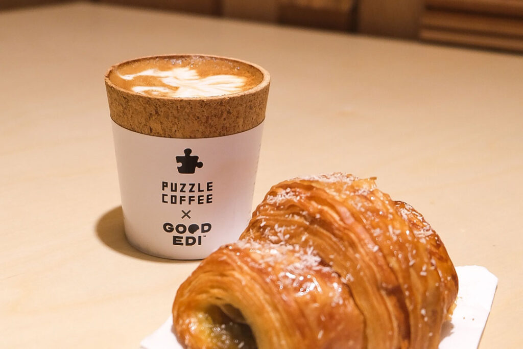 puzzle coffee edible coffee cup in orchard and kaya croissant
