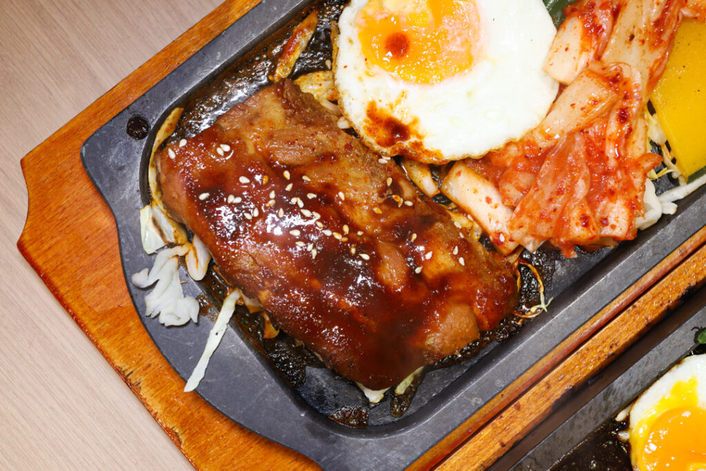 Pork Baby Back Ribs at Bulgogi Syo, served with fried egg and kimchi