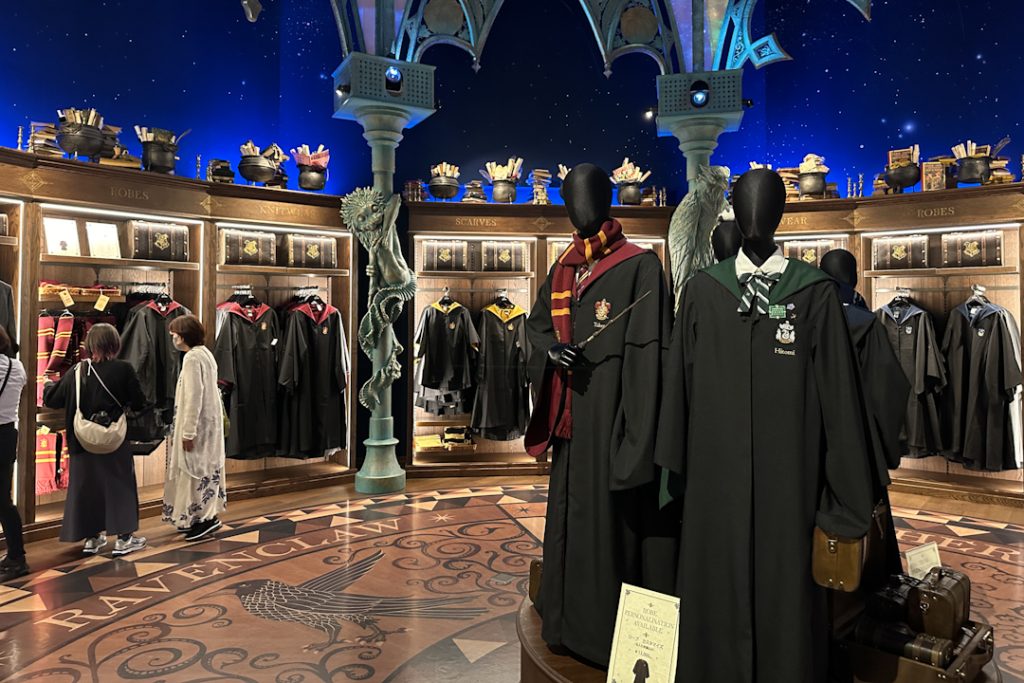 Harry Potter Hogwarts robes, wands, scarf and ties at the souvenir shop