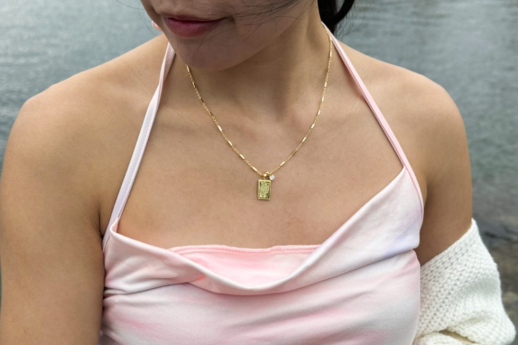 Wearing Birth Flower Pendant Necklace (April design) from Sachelle Collective