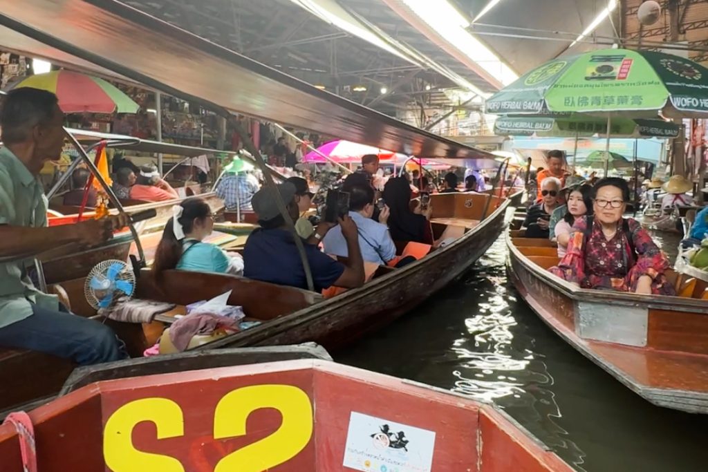 Boats on the water in the Damnoensaduak Floating Market -