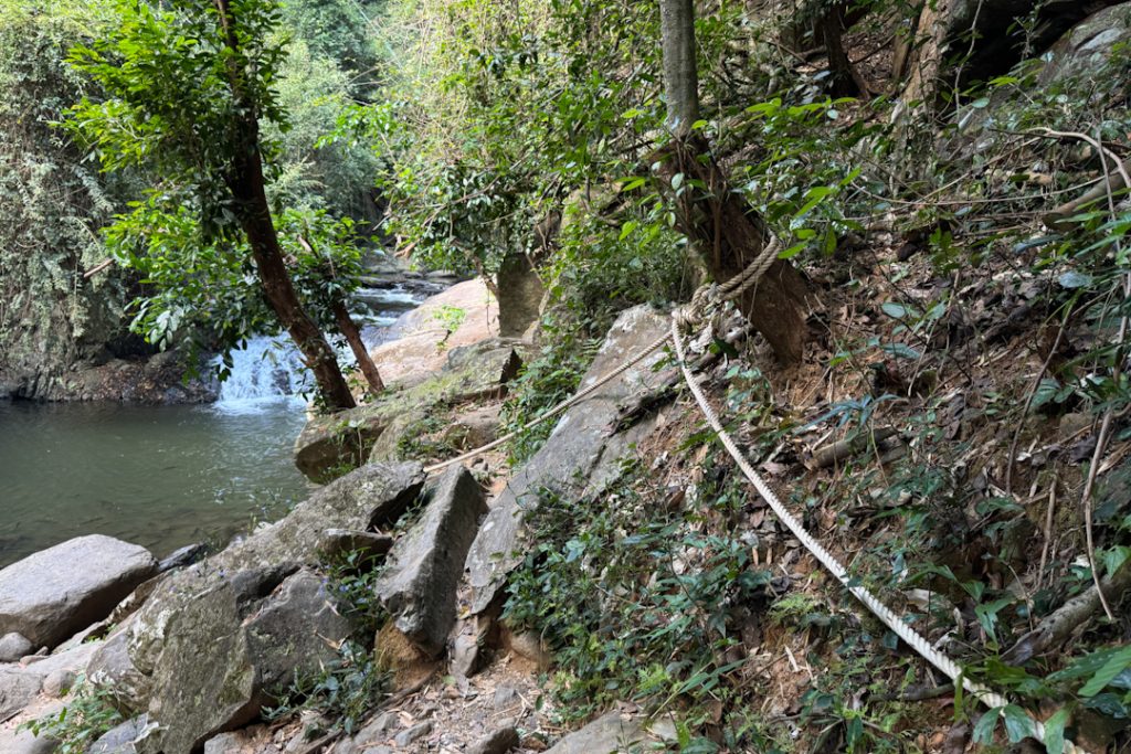 Hiking at Pa La U Waterfall hiking trail with rope