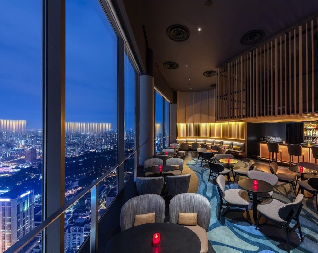 View of city lights from SKAI Bar