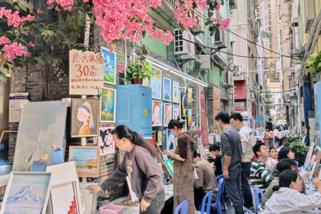 Artists selling their work at Dafen Oil Painting Village