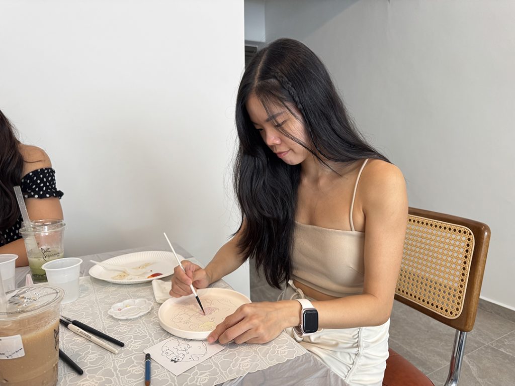 Me painting on me home pottery set from Oh Glorious Clay
