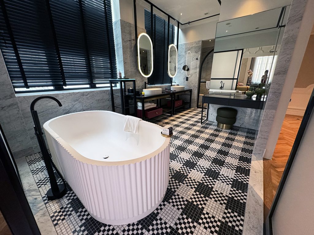 QT Singapore suite bathroom with bathtub