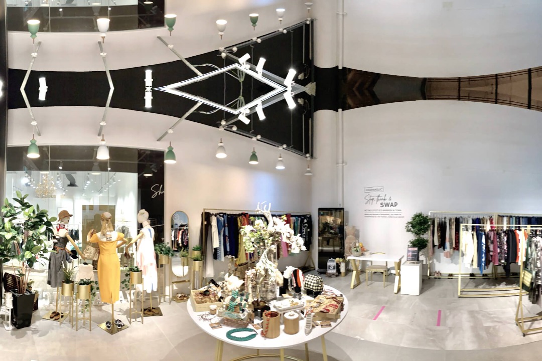 Racks of preloved fashion for swapping at Swapaholic, CQ Clarke Quay