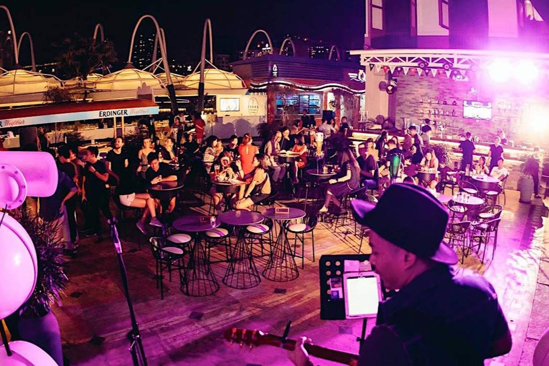 Alfresco bar tables along the Singapore River at YIN Bar, The Riverhouse