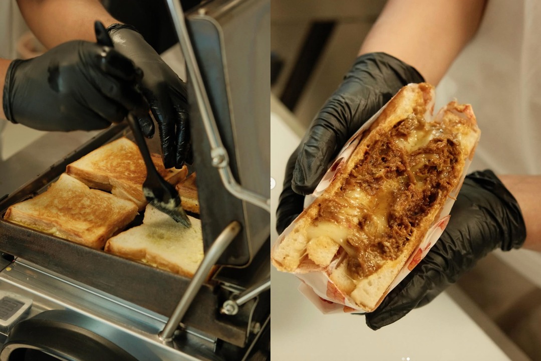 Open Secret alley cafe — cheese toasties being pressed and prepared
