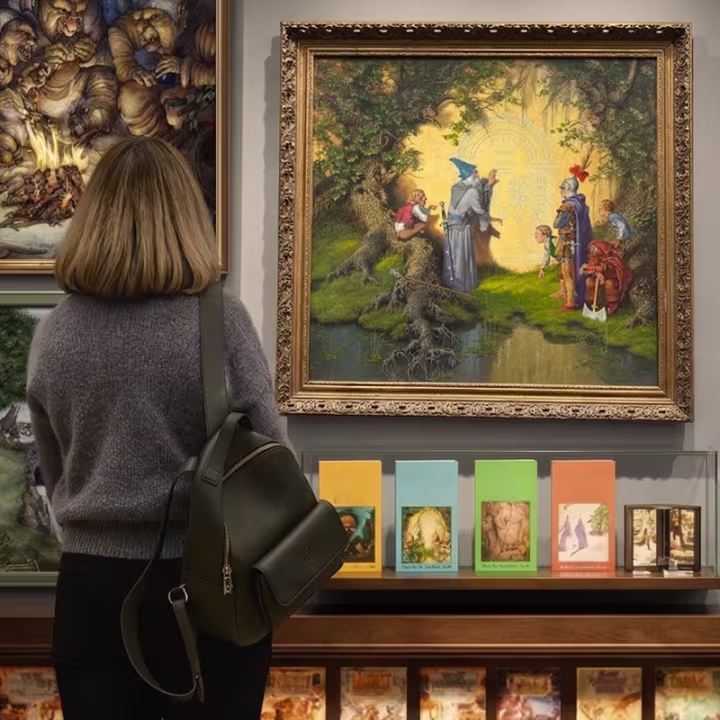 Woman looking at the artworks at PORTALS Experience Singapore